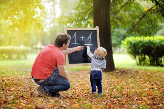 Father and his son practicing mathematics